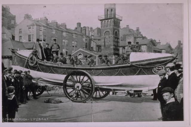 Scarborough ON 344 Self Righting Class "Edward and Lucille" on seafront surrounded by crowds of people buildings in background taken from the Grahame Farr Life-boat Archives