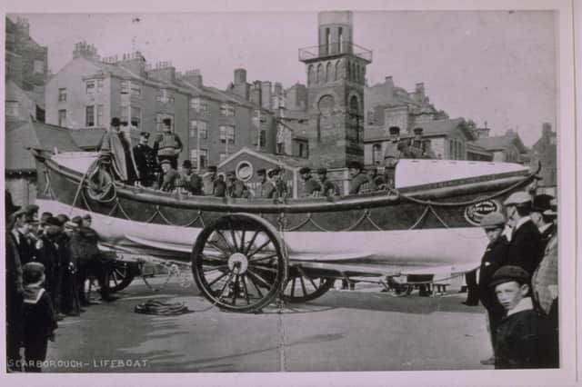 Scarborough ON 344 Self Righting Class  "Edward and Lucille"  on seafront surrounded by crowds of people  buildings in background  taken from the Grahame Farr Life-boat Archives