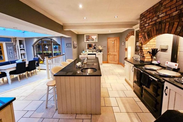 The stunning kitchen opens through to the sizeable dining area.