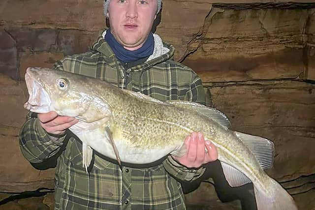 WSAA member Dylan Goldsmith who won both top prizes at the Cloughton Rock festive open, with his fine cod of 11lb 10oz that earned him the Heaviest Fish prize.  Photo by Neil Eglon