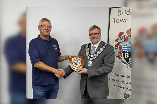 Town Mayor, Councillor John Arthur, presents the plaque to Brian Lampard. Photo courtesy of Bridlington Town Council.