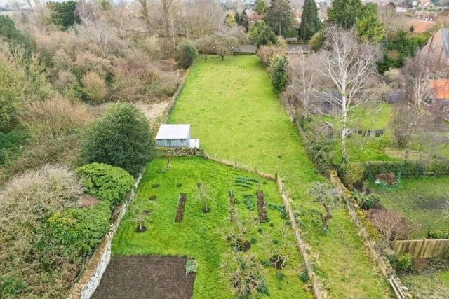 The sizeable plot includes these gardens.