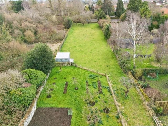 The sizeable plot includes these gardens.