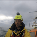 Whitby RNLI’s Shannon class all-weather lifeboat takes part in a training exercise with the HM Coastguard helicopter, practising winch operations for medical evacuations at sea. Photo credit: Whitby RNLI.