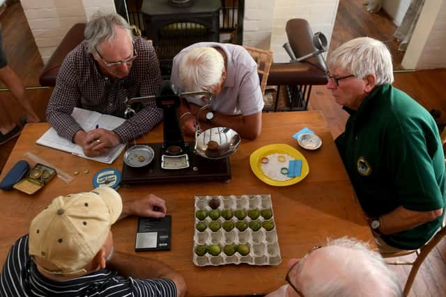 Judges weighing the gooseberries. Picture taken by Yorkshire Post photographer Simon Hulme.