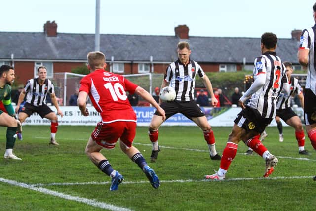 Harry Green looks on as Chorley gain possession.