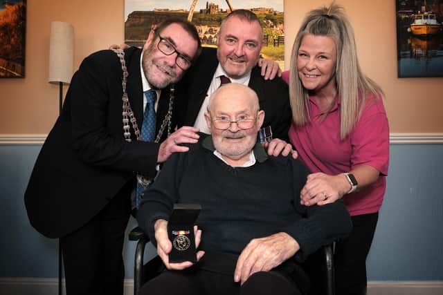 Eric Copeland pictured with his Nuclear Test medal with, from left to right: the Mayor of Whitby, Bob Dalrymple, Martin Drake, Chairman of Scarborough RAF Association and Jubilee House Activities Co-ordinator Jakki Edmond, who applied for the medal on Eric’s behalf.