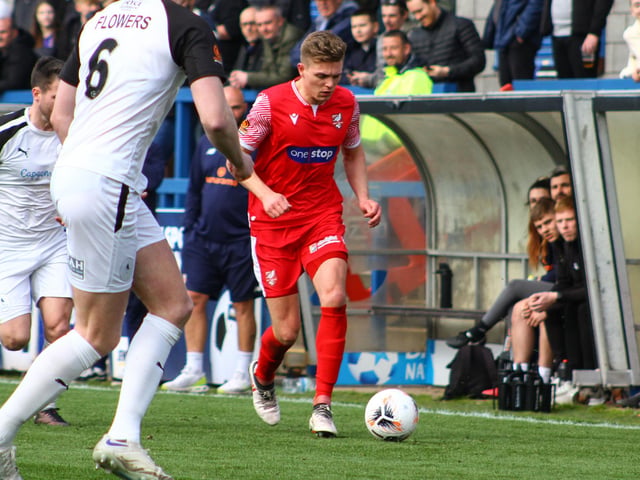 Jake Charles looks to get past a Telford defender.