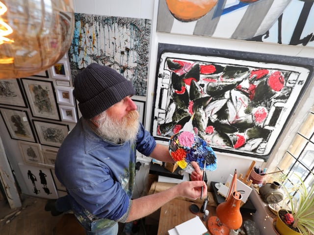 Anthony Springall working on his art in his West Pier studio