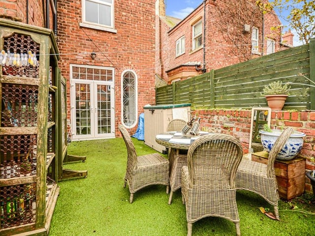 The rear enclosed garden provides sheltered space for al fresco dining.