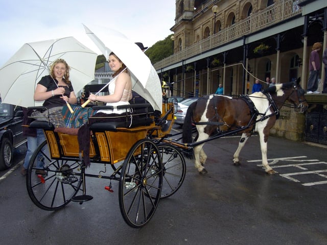 Graham School; Shelley Wilson and Varna Garvie make their big entrance in a horse and trap.