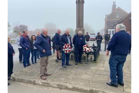 Sombre gathering at memorial in Flamborough to commemorate the double fishing boat tragedy of  May 7, 1984. Credit: Mark Smailes