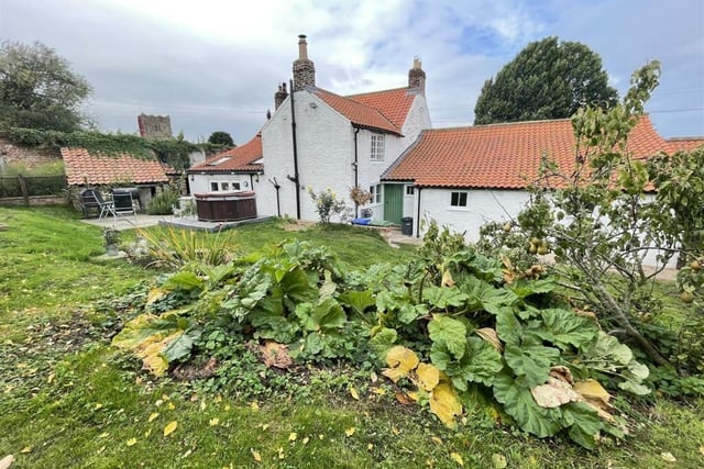 A view of the cottage from its gardens.