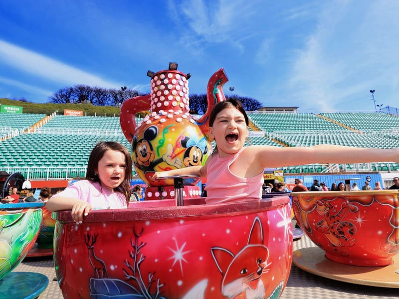 Saffron and Emmie having a blast on the teacups!