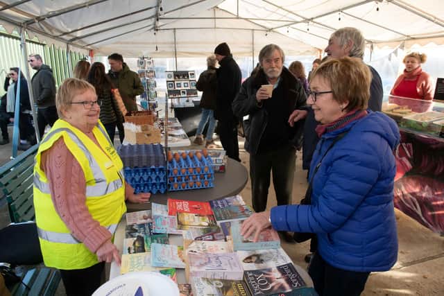 Cath Jenkinson (left) has raised more than £13,000 for the Yorkshire Air Ambulance through her book and jigsaw sales