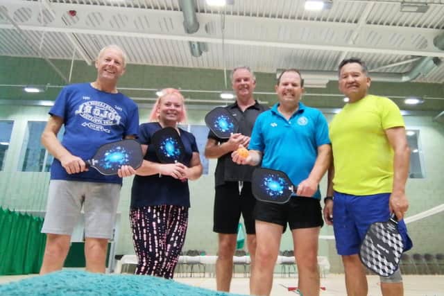Pickleball players, from left, Steve Mitchell, Jo Robinson, Keith Kynman, Paul Robinson and Juan Carlos Lino.