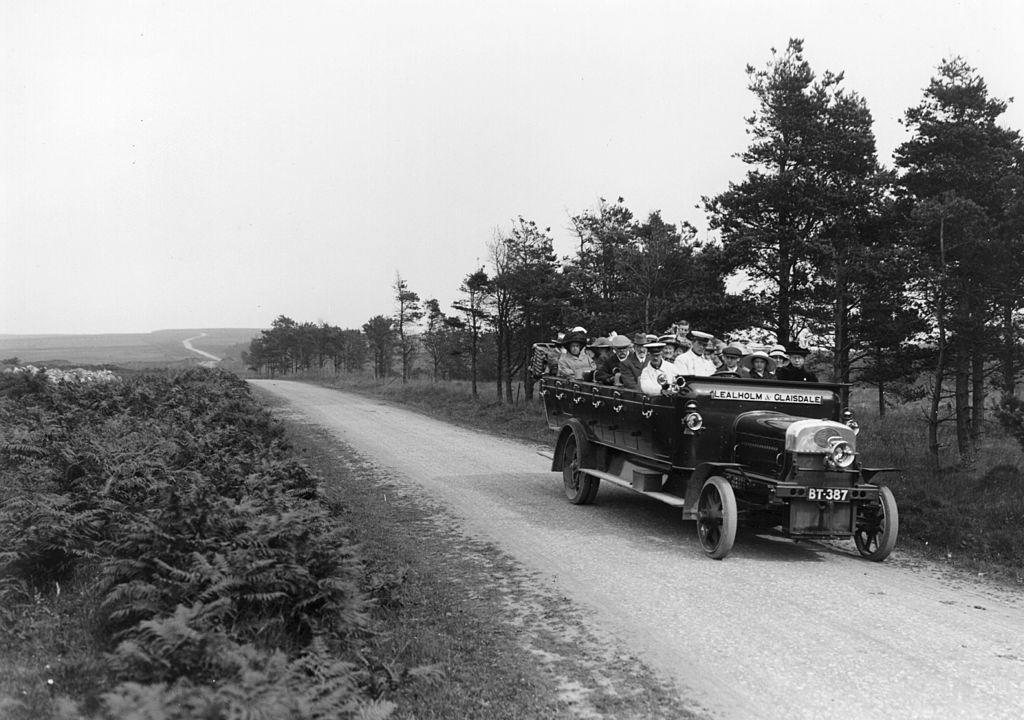 1913:  An early open topped charabanc taking passengers on a trip over the moors, near Whitby, North Yorkshire.  
(Photo by Hulton Archive/Getty Images)