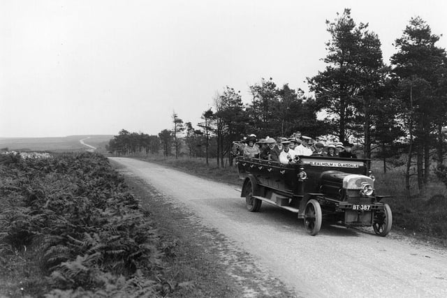 1913:  An early open topped charabanc taking passengers on a trip over the moors, near Whitby, North Yorkshire.  
(Photo by Hulton Archive/Getty Images)