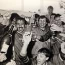 Boss Neil Warnock, Mitch Cook and his fellow Scarborough FC players celebrate promotion to the Football League