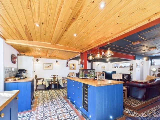 A closer look at the property's kitchen, with dining to the far end.