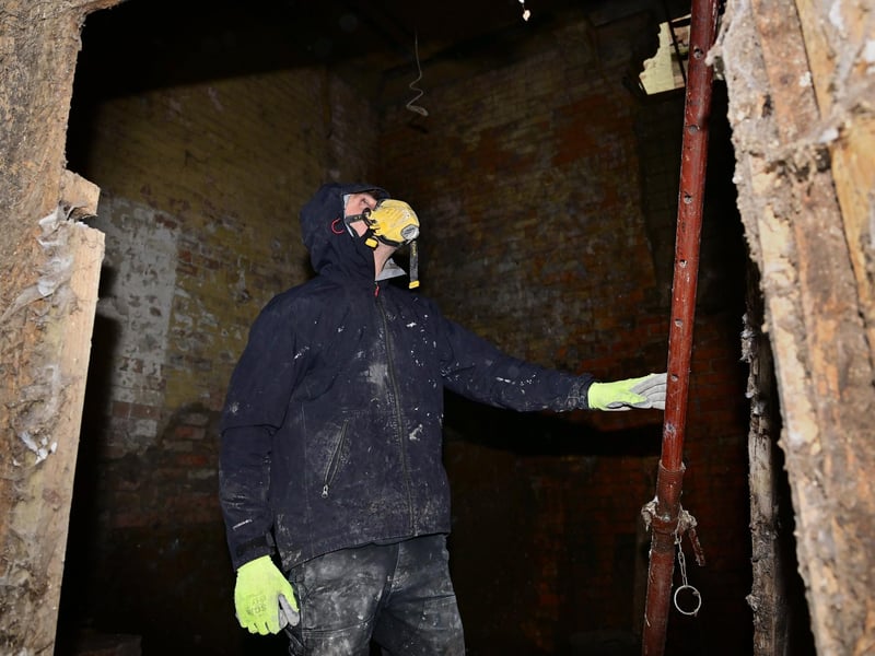 Jack Costigan looks inside the church prior to cleaning