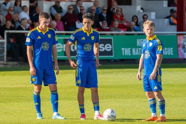 From left, Boro players Luca Colville, Rio Allan and Jack Waldron stand over a free-kick. Photo by Wilkins Photography