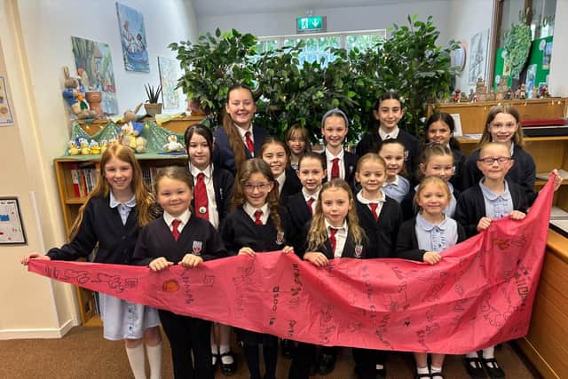 Pupils from East Ayton with the piece of Joseph's coat which they designed