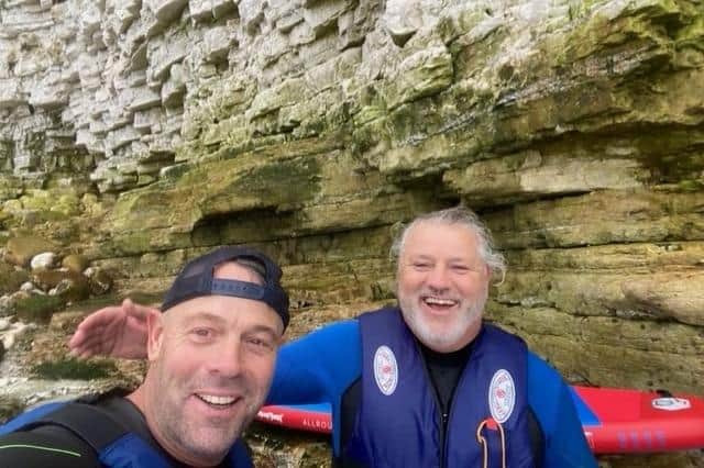 Paddleboarders Martin and Mick near the caves at North Landing. Photo: Martin