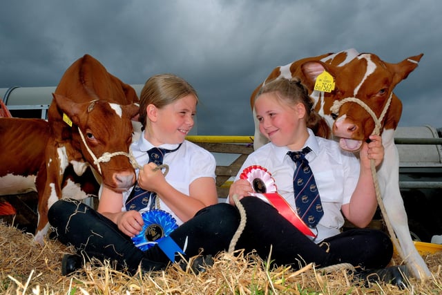 Isla Dickinson and Evie Hunter with their prize winning calves