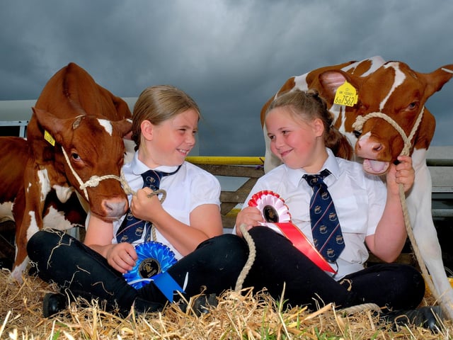 Isla Dickinson and Evie Hunter with their prize winning calves