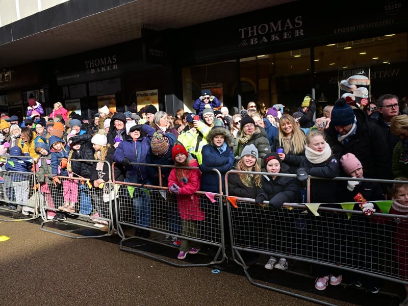 The crowds cheer on the racers.