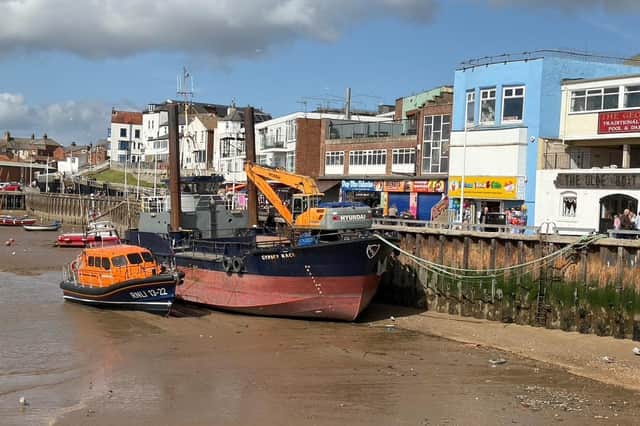 Ian Sandy captured this image of the lifeboat and dredger together.