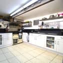 The fitted kitchen with range cooker is in the basement.