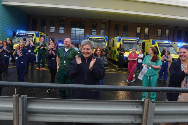 Ambulances flashed their lights for the one minute of applause.