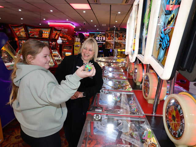 Winning prizes at Silver Dollar, with staff member Rachel