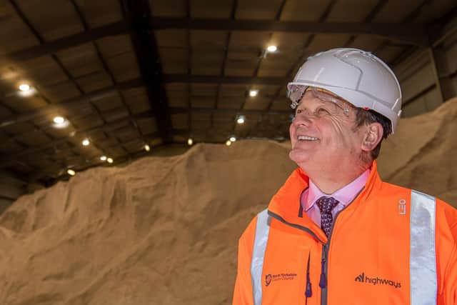North Yorkshire County Council’s executive member for climate change, Cllr Greg White, in the salt barn at Thirsk highways depot with the new LED lighting.