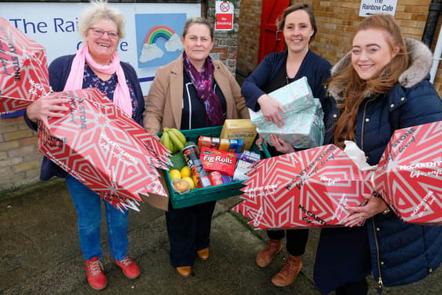 Trish Kinsella receives a donation to the food bank from McCarthy Stone - L-R Camilla Tite (Sales Consultant) Trish Kinsella, Zoe Phillips and Tina Morrell (Marketing Exec)