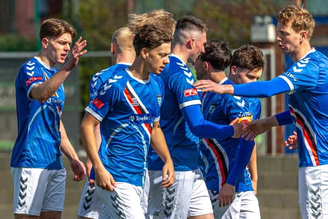 Jake Charles, far left, celebrates with his teammates after putting Whitby ahead early on at home to Hyde. Photo by Brian Murfield