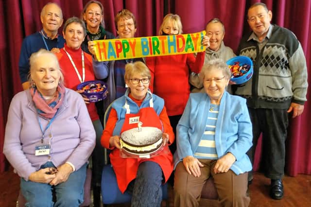 Volunteers from St John’s Burlington Church and Sewerby Women’s Institute, along with warm spaces attendees, celebrate the scheme's first anniversary.