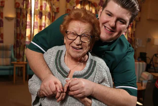 Whitby's Peregrine Home registered manager, Joe Bowman, dances with a resident.