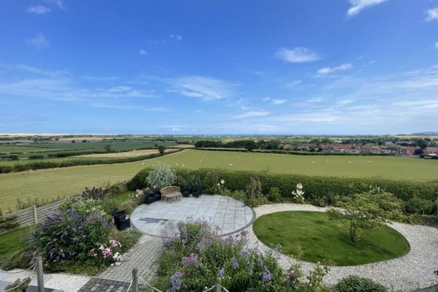 Landscaped gardens and stunning views that stretch for miles.