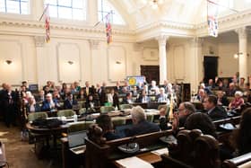 County councillors in the council chamber.