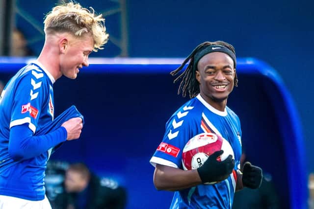 Donald Chimalilo celebrates his goal with Harley Dawson. Photo by Brian Murfield