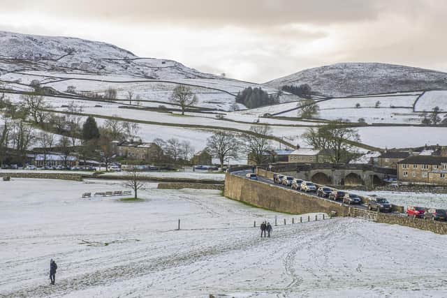 Wintery scenes at Burnsall in the Yorkshire Dales National Park after snow fell at Christmas time 2021