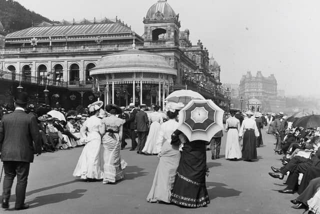 An archive image of fashions of the time on show as people walk along the promenade outside Scarborough Spa in the early 20th century. (Pic credit: North Yorkshire Archives)