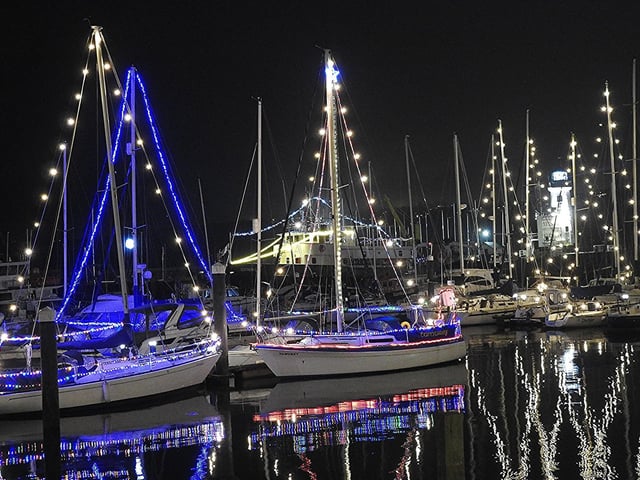 The lights adorn the boats in the harbour
