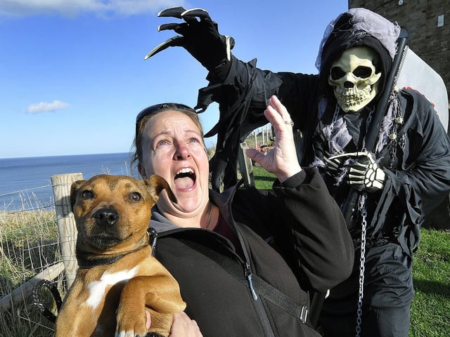 Ooh scary frights...Gav Woodward frightens Margaret Brailsford and dog Lottie. 144430j