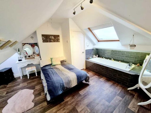 The third floor bedroom with en suite facility.