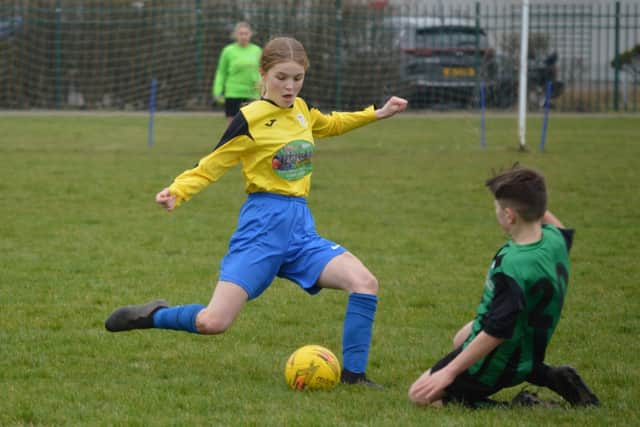 Heslerton Under-14s, yellow kit, in action against Eastfield