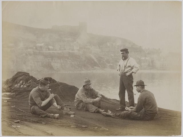 Fishermen mending their nets in Whitby, North Yorkshire, circa 1890.
(Photo by Frank Meadow Sutcliffe/Hulton Archive/Getty Images)